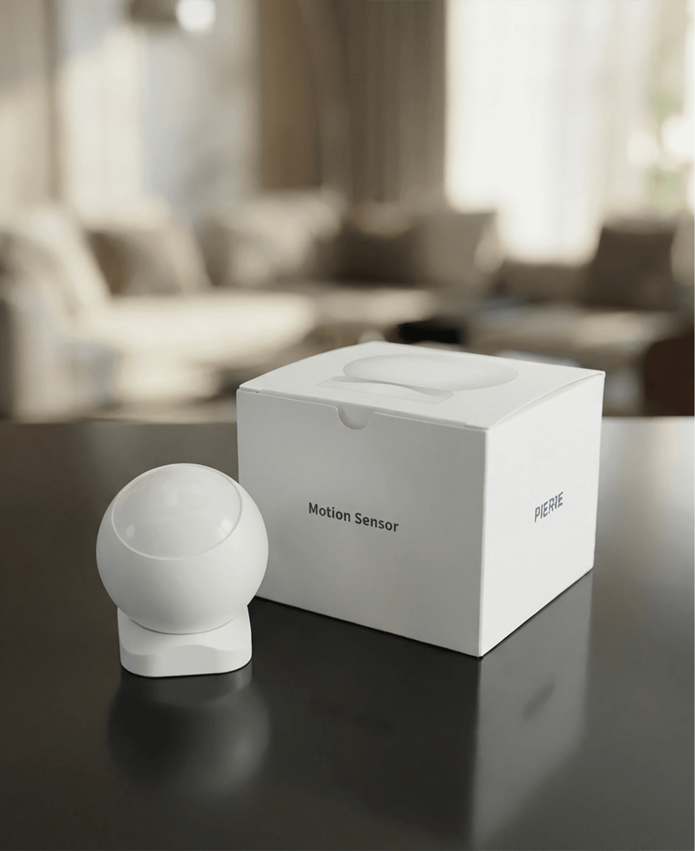 PIERRE Motion Sensor with packaging on a living-room table